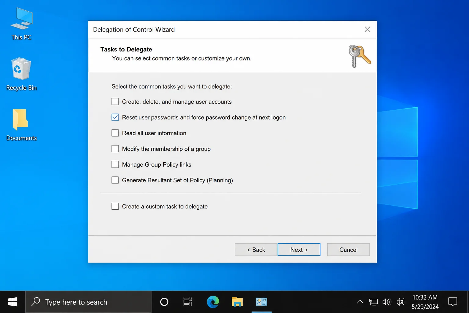 Delegation of Control Wizard Tasks to Delegate screen showing the common tasks checklist with Reset user passwords and force password change at next logon checked